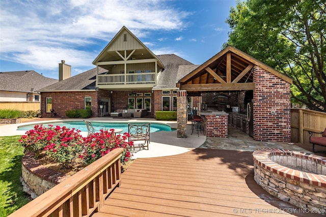 4501 E 108th Pl, Tulsa, OK 74137 - outdoor pool with an outdoor living space with a fire pit, a deck, and fence