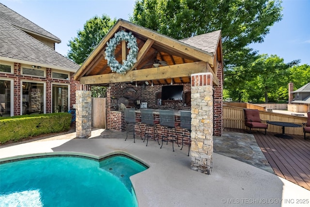 4501 E 108th Pl, Tulsa, OK 74137 - outdoor pool featuring a gazebo, fence, ceiling fan, a wooden deck, and a patio