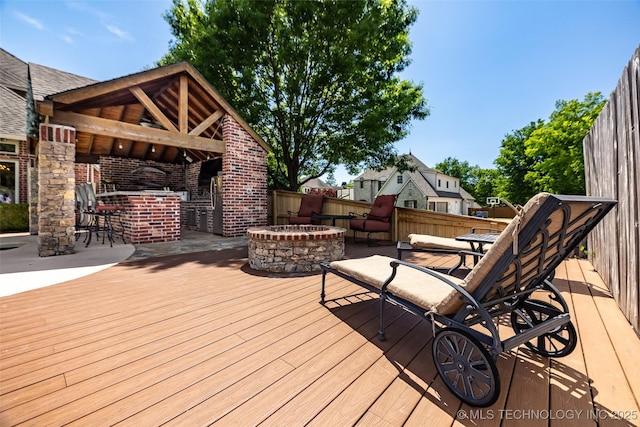 4501 E 108th Pl, Tulsa, OK 74137 - wooden terrace featuring a fire pit and fence