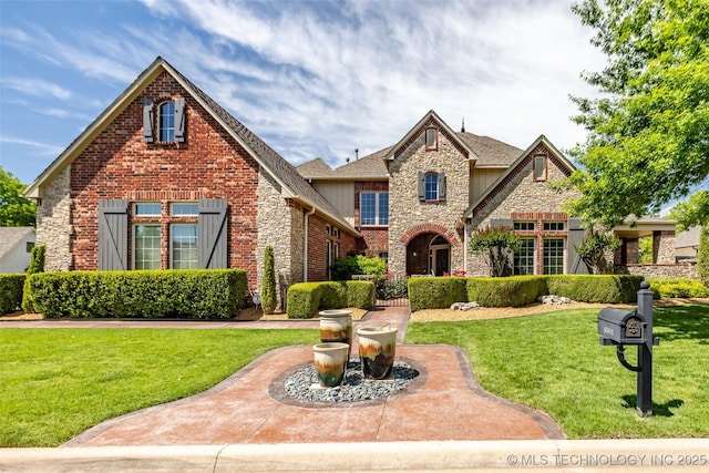 4501 E 108th Pl, Tulsa, OK 74137 - view of front of property with stone siding, a front lawn, and brick siding