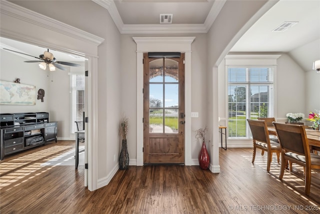 foyer entrance featuring dark wood finished floors, baseboards, ceiling fan, and crown molding
