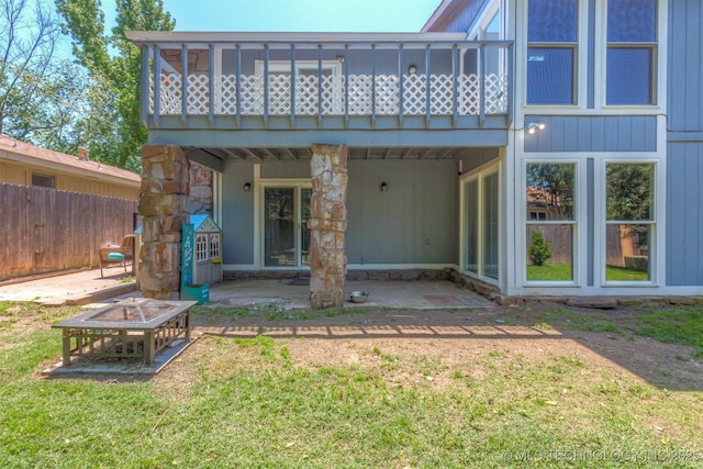 back of house with a patio