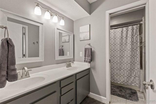 full bath with double vanity and curtained shower