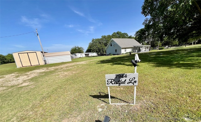 7944 Restful Ln, Kingston, OK 73439 - view of grassy yard featuring a storage shed and an outdoor structure