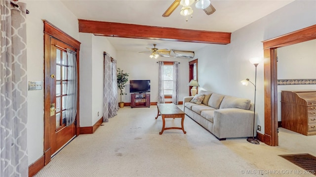 209 S Vine Ave, Cleveland, OK 74020 - living room featuring ceiling fan, carpet flooring, plenty of natural light, baseboards, and beamed ceiling