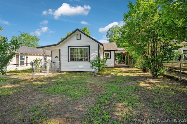 610 E 4th Ave, Bristow, OK 74010 - rear view of property featuring a deck
