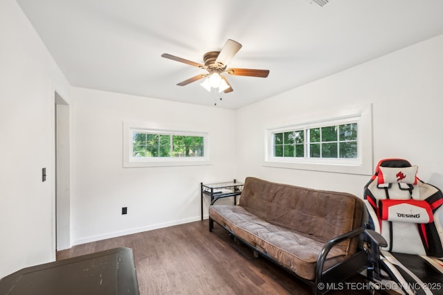 610 E 4th Ave, Bristow, OK 74010 - living room with wood finished floors, ceiling fan, and baseboards