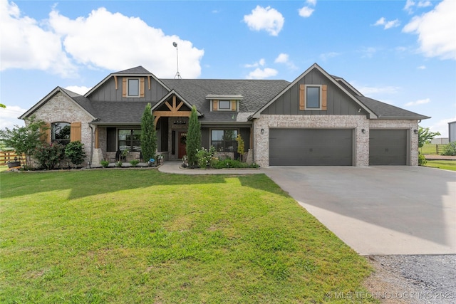 16990 S 33rd W Ave, Glenpool, OK 74033 - craftsman-style home with roof with shingles, concrete driveway, a front lawn, and board and batten siding