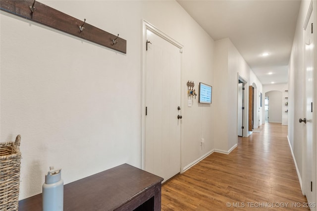 16990 S 33rd W Ave, Glenpool, OK 74033 - hallway with arched walkways, wood finished floors, baseboards, and recessed lighting