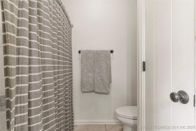 16990 S 33rd W Ave, Glenpool, OK 74033 - full bath with tile patterned flooring, baseboards, toilet, and a shower with shower curtain