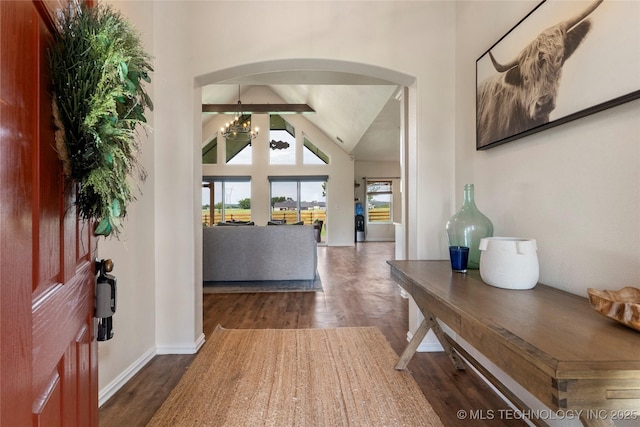 16990 S 33rd W Ave, Glenpool, OK 74033 - entryway with wood finished floors, arched walkways, high vaulted ceiling, and a chandelier
