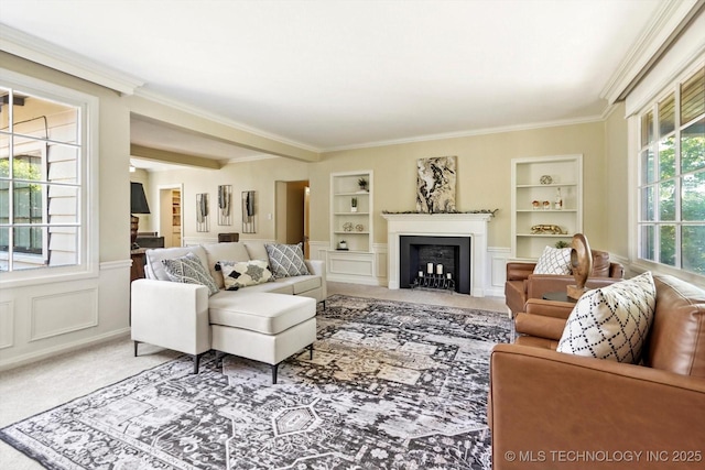 2650 S Utica Ave, Tulsa, OK 74114 - living area featuring built in features, carpet flooring, ornamental molding, a fireplace, and beamed ceiling