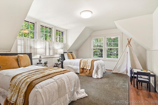 2650 S Utica Ave, Tulsa, OK 74114 - bedroom with multiple windows, vaulted ceiling, and wood finished floors