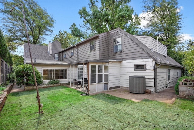 2650 S Utica Ave, Tulsa, OK 74114 - rear view of house featuring central air condition unit, a patio, a chimney, and a shingled roof