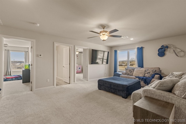 10104 S 227th E Ave, Broken Arrow, OK 74014 - carpeted living room featuring ceiling fan and baseboards