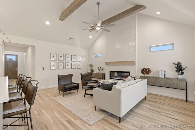 1331 N Beech St, Broken Arrow, OK 74012 - living room with high vaulted ceiling, light wood-style floors, a fireplace, beamed ceiling, and baseboards