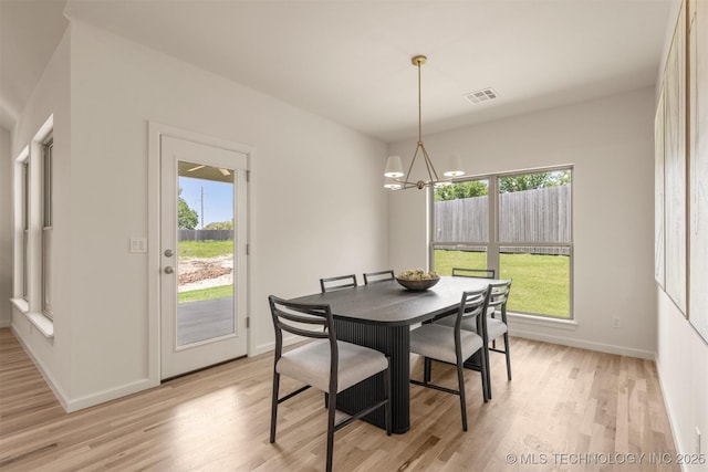 1331 N Beech St, Broken Arrow, OK 74012 - dining area with a chandelier, light wood finished floors, and baseboards
