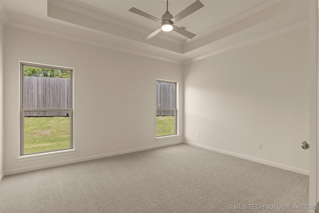 1331 N Beech St, Broken Arrow, OK 74012 - empty room featuring a tray ceiling, ceiling fan, baseboards, crown molding, and carpet floors