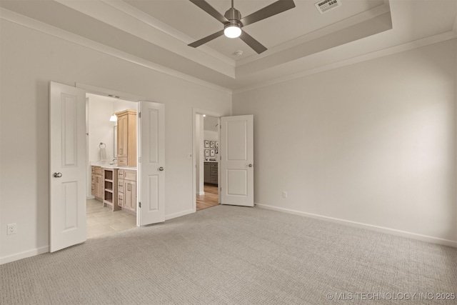 1331 N Beech St, Broken Arrow, OK 74012 - unfurnished bedroom with light carpet, ornamental molding, a tray ceiling, baseboards, and ensuite bath