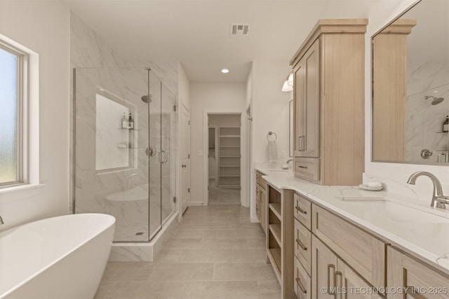 1331 N Beech St, Broken Arrow, OK 74012 - full bathroom with a marble finish shower, vanity, a freestanding bath, a spacious closet, and recessed lighting