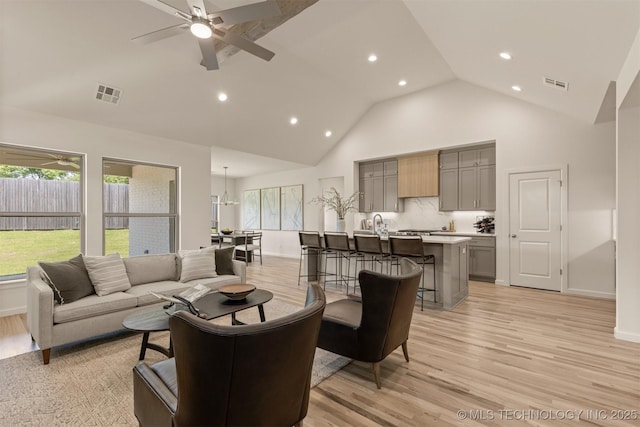 1331 N Beech St, Broken Arrow, OK 74012 - living room with light wood-style flooring, high vaulted ceiling, plenty of natural light, recessed lighting, and a ceiling fan