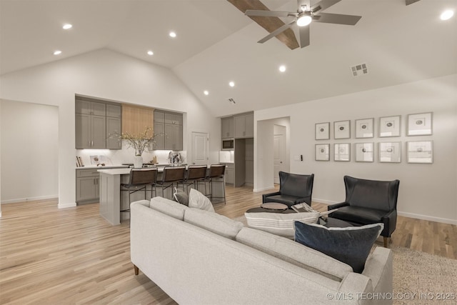 1331 N Beech St, Broken Arrow, OK 74012 - living area with high vaulted ceiling, recessed lighting, light wood finished floors, ceiling fan, and baseboards
