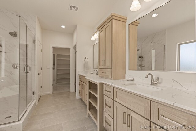 1331 N Beech St, Broken Arrow, OK 74012 - full bath featuring a marble finish shower, a spacious closet, vanity, and recessed lighting