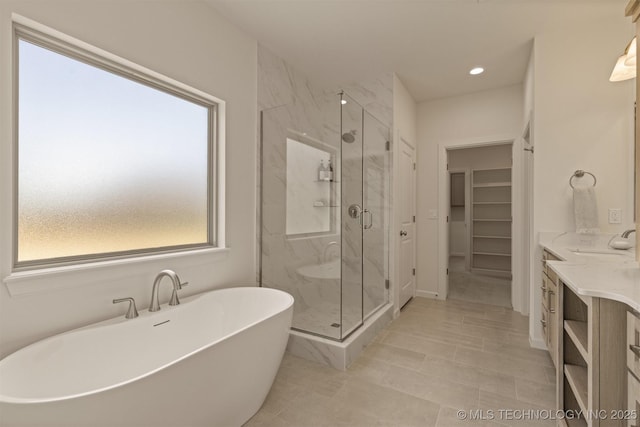 1331 N Beech St, Broken Arrow, OK 74012 - full bathroom with a marble finish shower, a soaking tub, a walk in closet, vanity, and recessed lighting