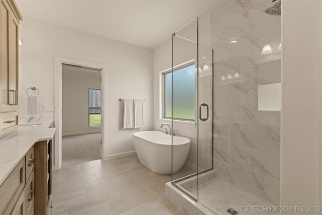 1331 N Beech St, Broken Arrow, OK 74012 - full bathroom with vanity, a marble finish shower, a freestanding tub, and baseboards