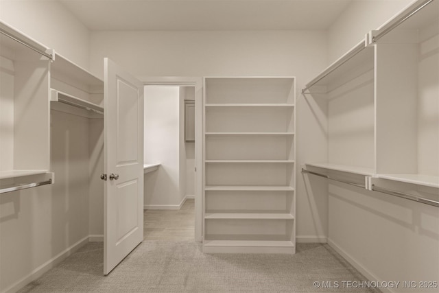 1331 N Beech St, Broken Arrow, OK 74012 - walk in closet featuring light carpet