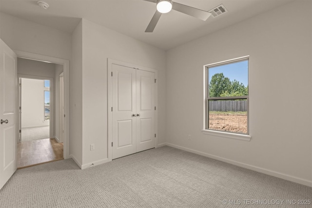 1331 N Beech St, Broken Arrow, OK 74012 - unfurnished bedroom with light colored carpet, baseboards, a closet, and a ceiling fan