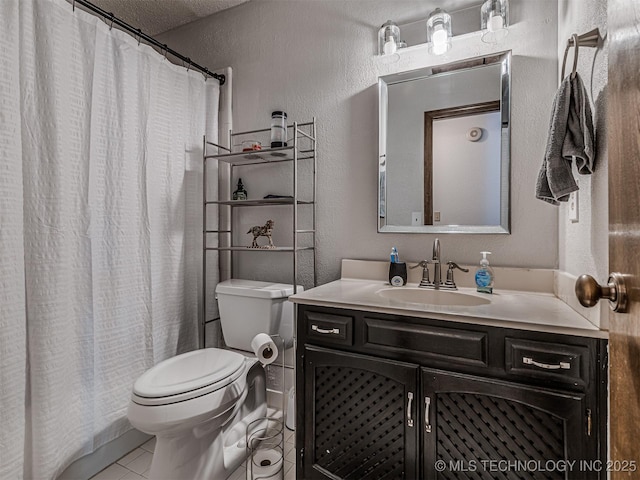 full bath featuring a textured wall, toilet, vanity, tile patterned flooring, and a shower with shower curtain