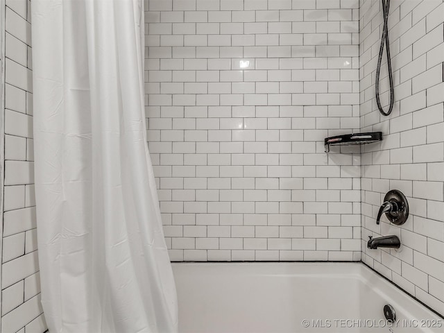 bathroom with shower / bath combination with curtain