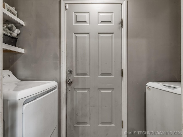 laundry room featuring washer and clothes dryer