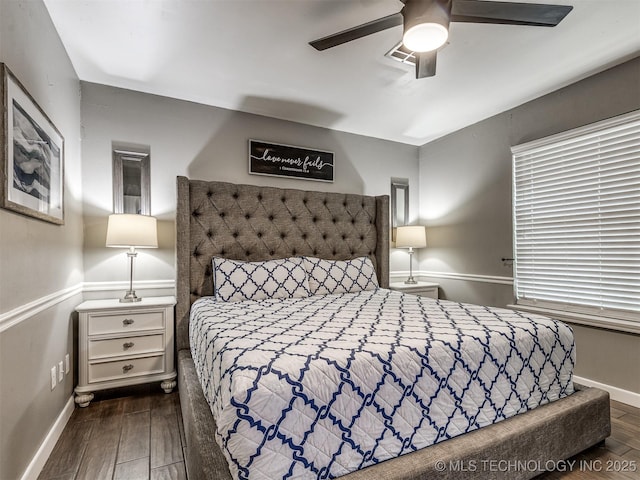 bedroom with wood finished floors, baseboards, and ceiling fan