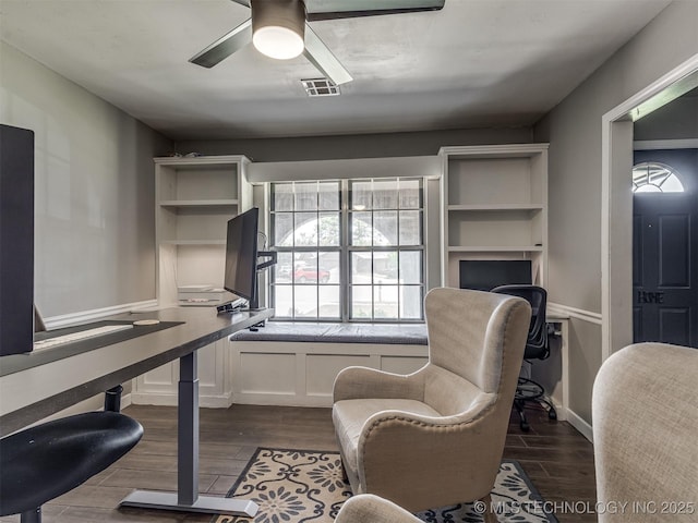 office area featuring dark wood-style floors, a ceiling fan, plenty of natural light, and baseboards