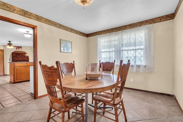 2750 Enterprise, Lone Grove, OK 73401 - dining room featuring light tile patterned floors, a ceiling fan, and baseboards