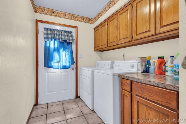 2750 Enterprise, Lone Grove, OK 73401 - washroom featuring washing machine and clothes dryer, cabinet space, baseboards, and light tile patterned flooring