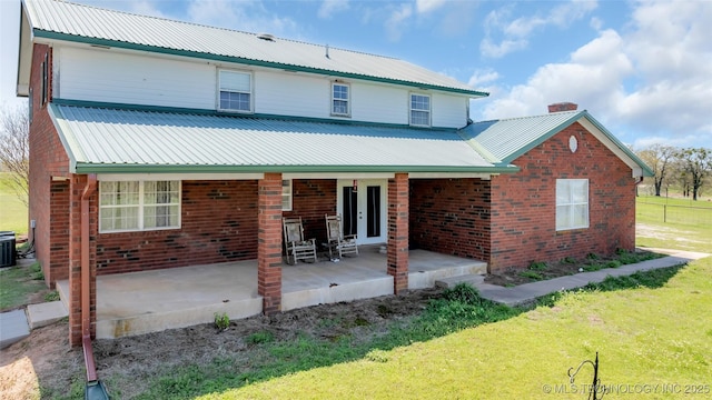 2750 Enterprise, Lone Grove, OK 73401 - back of property with metal roof and a yard