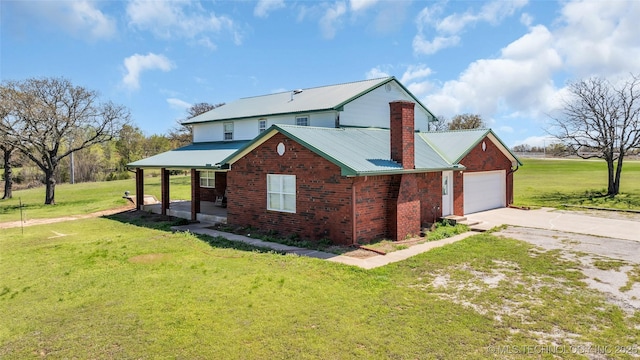 2750 Enterprise, Lone Grove, OK 73401 - view of side of property featuring driveway, a yard, brick siding, and covered porch