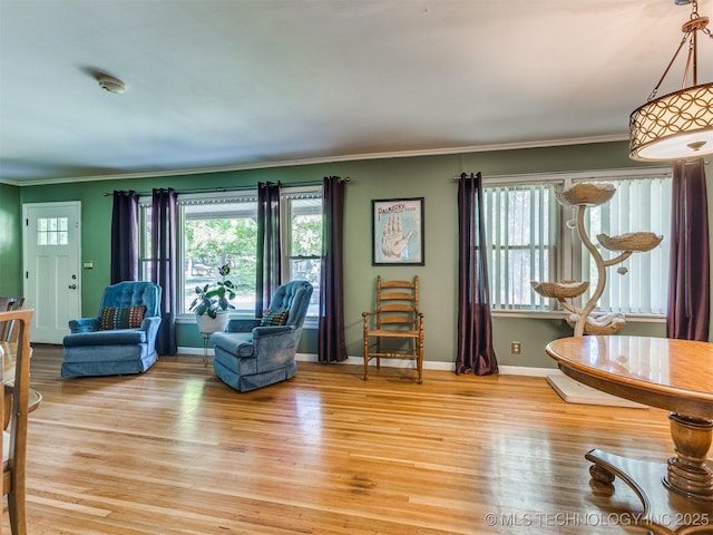 3931 S Oswego Ave, Tulsa, OK 74135 - living room with crown molding, light wood-style flooring, and baseboards