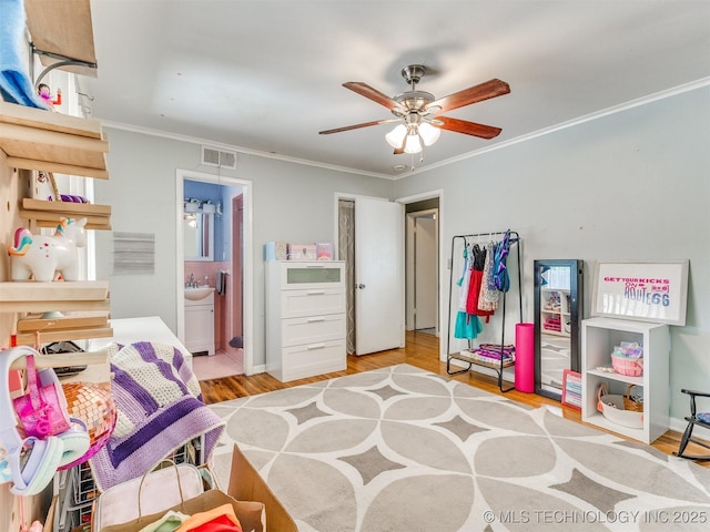 3931 S Oswego Ave, Tulsa, OK 74135 - bedroom with light wood-type flooring, ornamental molding, ensuite bath, and a ceiling fan