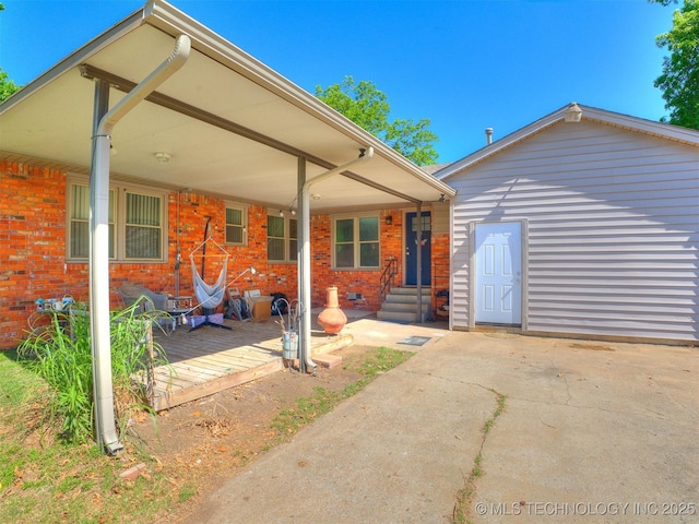 3931 S Oswego Ave, Tulsa, OK 74135 - view of front of home featuring brick siding, a deck, and entry steps