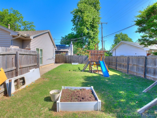 3931 S Oswego Ave, Tulsa, OK 74135 - view of yard with a playground and a vegetable garden