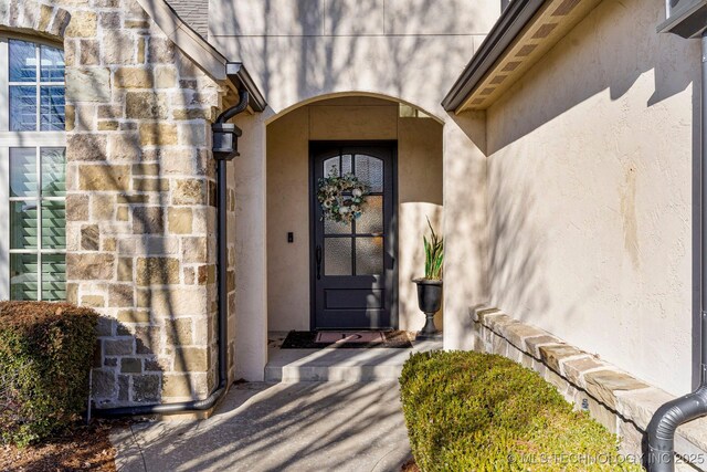 9475 E 107th Pl S, Bixby, OK 74133 - view of exterior entry with stucco siding and stone siding