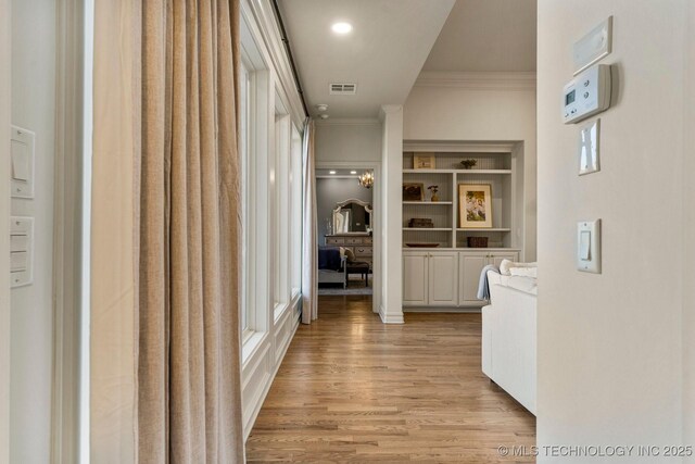 9475 E 107th Pl S, Bixby, OK 74133 - corridor with ornamental molding and light wood-style flooring