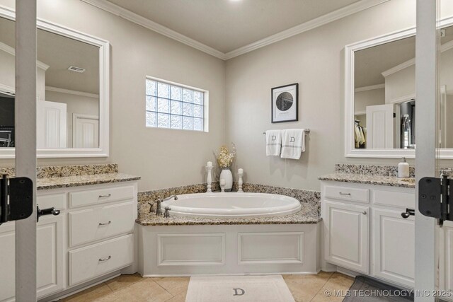 9475 E 107th Pl S, Bixby, OK 74133 - bathroom featuring tile patterned floors, a garden tub, ornamental molding, and vanity