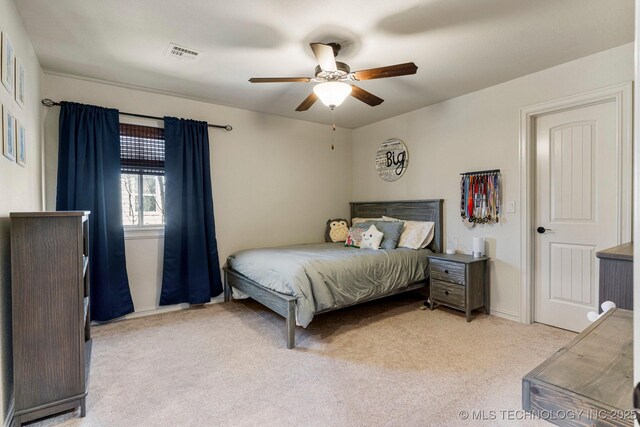 9475 E 107th Pl S, Bixby, OK 74133 - bedroom with light carpet, baseboards, and ceiling fan