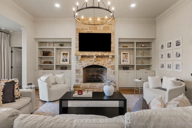 9475 E 107th Pl S, Bixby, OK 74133 - living room with crown molding, wood finished floors, a fireplace, a chandelier, and recessed lighting