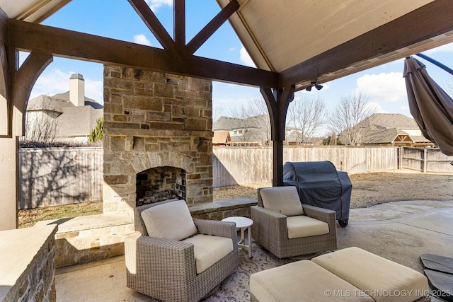 9475 E 107th Pl S, Bixby, OK 74133 - view of patio / terrace featuring an outdoor stone fireplace, a fenced backyard, and area for grilling